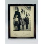 A 1956 framed Black and White Photograph of HRH Prince Philip and HRH Queen Elizabeth II with