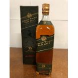 A Bottle of Green Label Johnnie Walker Pure Malt Scotch Whisky