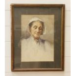 A framed oil painting of an old lady in a bonnet (55cm X 44cm)