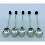 Five silver coffee spoons in the coffee bean style