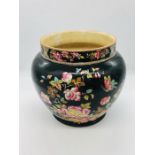A black oriental style plant pot by Adams Tunstall