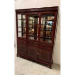 A Large display cabinet with three drawers and three cupboards underneath