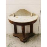 A marble topped washstand with cabriole front leg and two supporting back legs AF