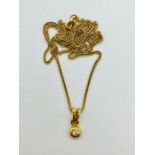 An 18ct yellow gold necklace with diamond pendant (4.39g)