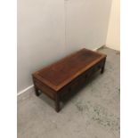 An Oriental style coffee table with three drawers (H40cm D50cm W127cm)