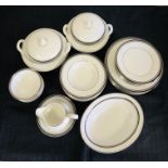A Royal Doulton Eight piece dinner service in the Sarabande pattern to include two tureens and a