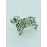 A solid sterling silver figure of a dog