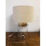 A Table lamp with storage jar base