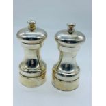 A silver salt and pepper set hallmarked for the year 2000 by maker MCH