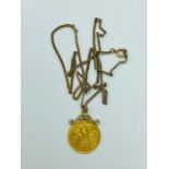A Half Sovereign in a 9ct yellow gold mount and chain (8.89g)