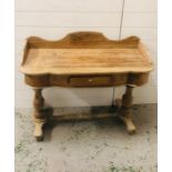 A large pine double washstand or hall table with drawer on double pedestal legs with stretcher
