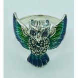 A silver and plique a jour ring in the form of an owl