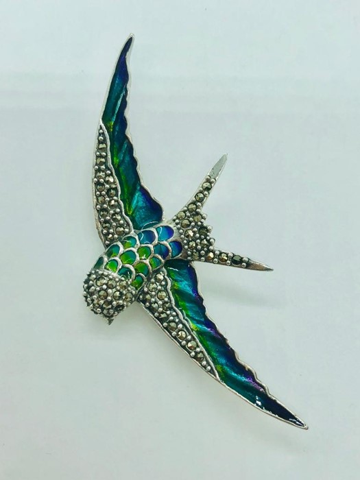 A silver and plique a jour brooch in the form of a bird