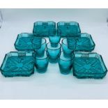 Six low cut glass dishes and six shot glasses in sea green
