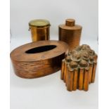 A selection of jelly moulds and copper jars