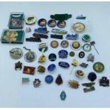 A selection of enamel pin badges including many of a railway theme, scouts, Butlins and union badges