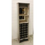 A cupboard with shelving and wine rack