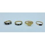 A selection of four 9ct yellow gold rings (8.49g) to include a signet ring, a ring with rubies and