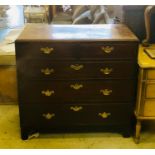 A Georgian chest of drawers two over three with brass drop handles