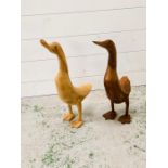 Two standing wooden ducks