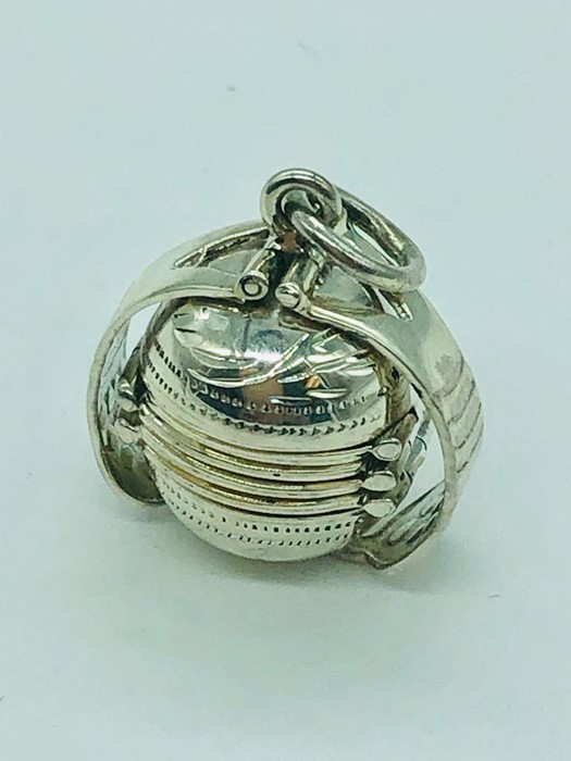 A silver ball shaped locket