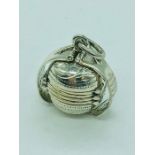 A silver ball shaped locket