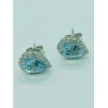 A pair of 18ct white gold aquamarine and diamond pear shaped stud earrings of 1.2ct's approx.