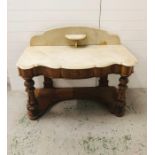 A large double marble topped washstand/dressing table with one drawer, serpentine style front and