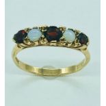 A 9ct gold ruby and opal ring