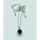 An 18ct white gold diamond and amethyst pendant necklace on gold chain 90 [points approx.