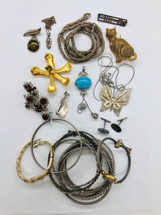 A selection of costume jewellery to include silver.