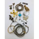 A selection of costume jewellery to include silver.