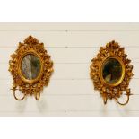 A Pair of Antique mercury mirrors and wall sconces with candle holders.