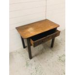 An oak hall table with one drawer and two brass handles (H66cm W89cm D49cm)