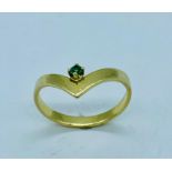 18ct yellow gold ring with small emerald stone
