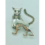 A silver brooch in the form of a cat with marcasites