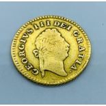 A 1798 George III 1/3 Guinea coin.