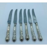 A set of six silver handled knives, makers mark HB (Possibly Harrison Brothers Sheffield 1965