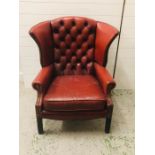 A Red Leather Button Back Armchair