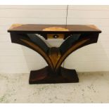 An Art Deco style console table with marquetry detailing