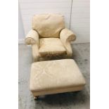 A Howard style arm chair on castors by Duresta with matching foot stool