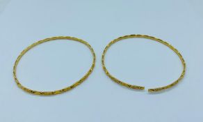 A Pair of thin 22ct bangles, one AF. (16.6g)