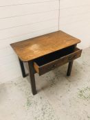 An oak hall table with one drawer and two brass handles (H66cm W89cm D49cm)