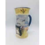 A blue handled hand painted pottery jug with cats bearing the initials CC