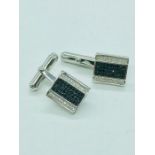 A pair of silver and CZ cufflinks