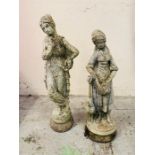 Two garden statues, one of a goddess and one of a farm girl