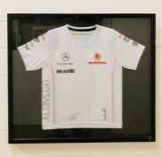 A Framed Mercedes McLaren shirt, child's size.