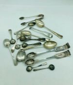 A volume of hallmarked silver to include a variety of spoons and some scrap silver.