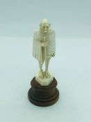 An Antique Indian carved ivory figure of Mahatma Gandhi.