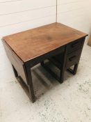 A Two drawer desk with drop leaf side in a simple style AF